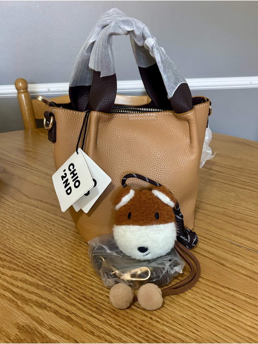 NWOT Tan Pebbled crossbody Bucket Bag with Plush Fox Charm